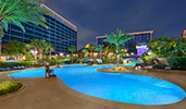 A large, asymmetrical pool behind the Disneyland Hotel
A large, asymmetrical pool behind the Disneyland Hotel