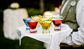 A Cast Member carries a variety of cocktails on a serving tray
A Cast Member carries a variety of cocktails on a serving tray