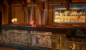 At the registration desk, animal shaped accent lamps sit atop a counter with sculpted images of bears
At the registration desk, animal shaped accent lamps sit atop a counter with sculpted images of bears