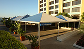 An overhead sign says Pier Side pavilion at the entrance to a large, tented outdoor area
An overhead sign says Pier Side pavilion at the entrance to a large, tented outdoor area