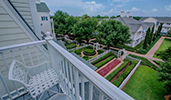 A patio chair faces a lake on a Disney's Boardwalk Inn hotel room balcony
A patio chair faces a lake on a Disney's Boardwalk Inn hotel room balcony