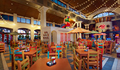 Pepper Market inside Disneys Coronado Springs Resort featuring tables with condiments, chairs, tile flooring, windows and bistro lights Pepper Market inside Disneys Coronado Springs Resort featuring tables with condiments, chairs, tile flooring, windows and bistro lights