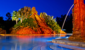 The Lost City of Cibola pool illuminated at night with a fountain, railings and a 50 foot pyramid with palm trees, stone steps and more The Lost City of Cibola pool illuminated at night with a fountain, railings and a 50 foot pyramid with palm trees, stone steps and more