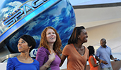 Smiling people standing outside of Mission SPACE at Epcot Smiling people standing outside of Mission SPACE at Epcot