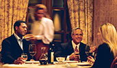 Three Guests sit in an elegant restaurant and enjoy a bottle of wine
Three Guests sit in an elegant restaurant and enjoy a bottle of wine