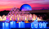 A chef stands behind an outdoor buffet station set up in front of a giant fountain
A chef stands behind an outdoor buffet station set up in front of a giant fountain