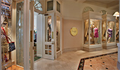 The boutique doors of Summer Place are open, and glass cases display women's clothing and accessories
The boutique doors of Summer Place are open, and glass cases display women's clothing and accessories