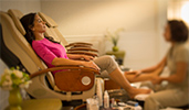 A Guest in a spa chair gets a pedicure and a leg massage
A Guest in a spa chair gets a pedicure and a leg massage