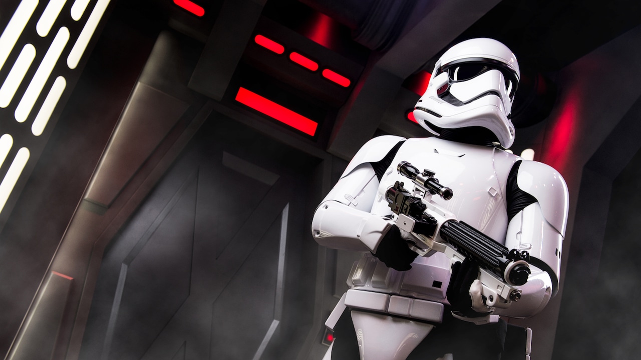 An imperial stormtrooper holds his blaster