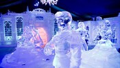 An ice sculpture tableau of the ball scene from Disney's Frozen is on display