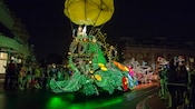 Tinker Bell greets Guests from atop her nature-themed float