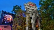 Sign for Star Tours next to an AT-AT Walker