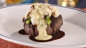A steak filet Oscar style, with lump crab, grilled asparagus and Hollandaise sauce