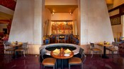 A table for 2 next to the swirling cenote fountain at Maya Grill