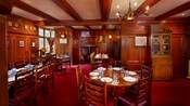 Benjamin Franklin dining room featuring beamed ceiling, fireplace and brass chandelier