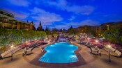 The Fountain Pool at Disney’s Grand Californian Hotel & Spa is surrounded by lounge chairs at dusk The Fountain Pool at Disney’s Grand Californian Hotel & Spa is surrounded by lounge chairs at dusk