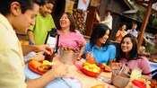 Family and friends share a meal at Big Thunder Ranch BBQ, a Disneyland restaurant