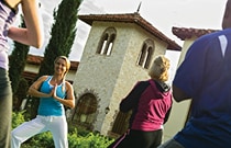Activities and Recreational Offerings at Summerhouse A group of 4 people doing yoga outdoors in a grassy courtyard