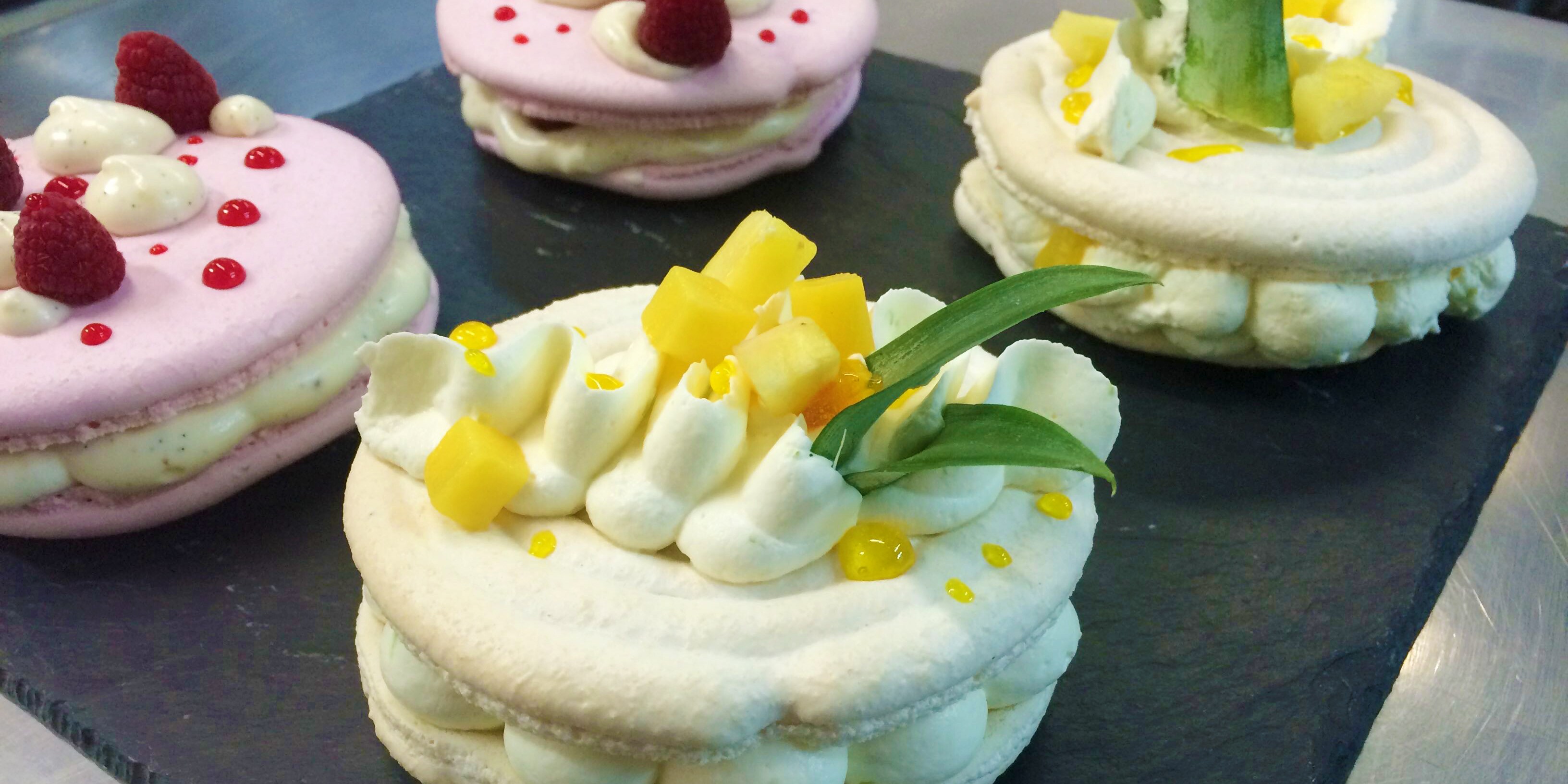 A tray of 4 decorated macarons