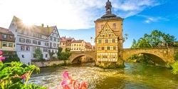 The Old Town Hall in Bamberg with the Regnitz River flowing under its bridge