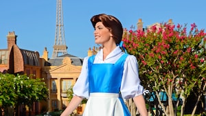 Belle smiling while she awaits Guests during a Character Greeting experience at the France Pavilion