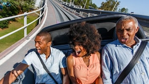 A family of Guests screams in enjoyment during an exhilarating ride aboard Test Track in Future World