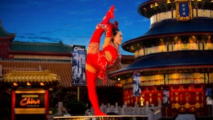 A female performer from Jeweled Dragon Acrobats poses during a show at the China Pavilion at Epcot