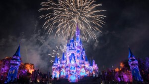 A fireworks and laser light show occurring above Cinderella Castle