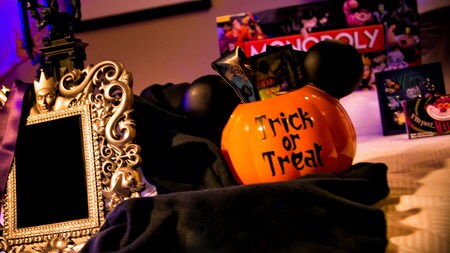 a mickey inspired jack o lantern basket filled with disney treats sits next to a framed - Where Does The Halloween Celebration Come From a mickey inspired jack o lantern basket filled with disney treats sits next to a framed - Where Does The Halloween Celebration Come From