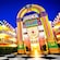 Exterior of Disney’s All Star Music Resort illuminated at night