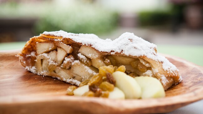 Cross section of apple strudel with golden raisins dusted with powered sugar