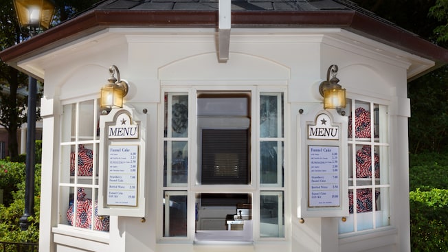 Exterior of white Funnel Cake kiosk at The American Adventure at Epcot