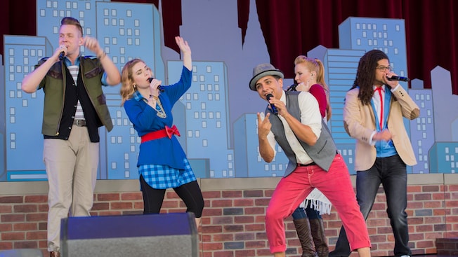 Singers clad in stylish wear perform during the American Music Machine in American Adventure at Epcot