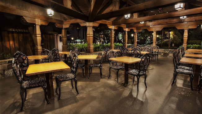 Wood tables and wrought-iron chairs on patio of Kringla Bakeri og Kafe