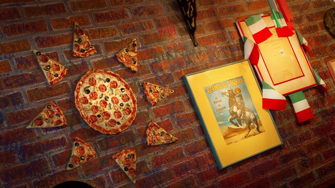 Italian flags, framed book covers and pizza-shaped art on brick wall