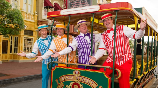 The Dapper Dans pose on a horse-driven trolley car on Main Street, U.S.A.