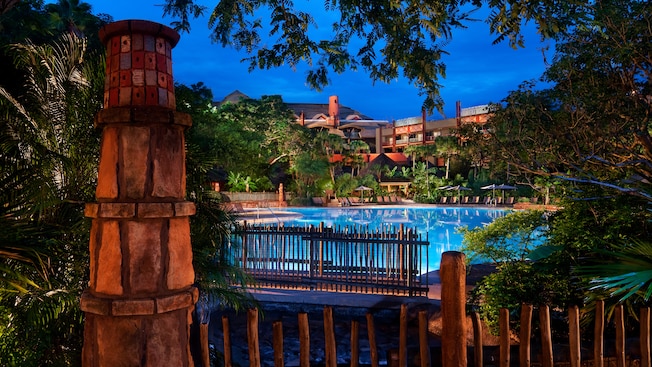 The Uzima Pool area at Disney's Animal Kingdom Lodge, lit up at night