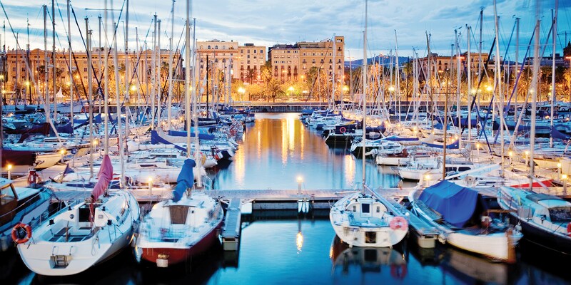 Dozens of boats docked in a harbor