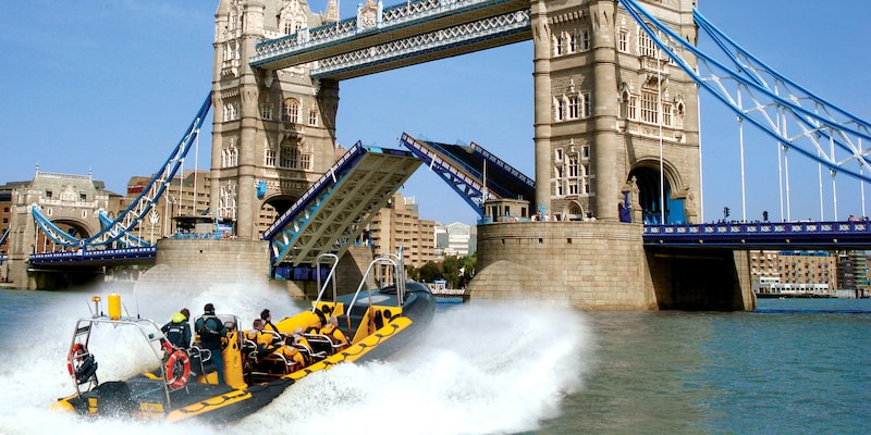 A speedboat races towards Tower Bridge on the River Thames