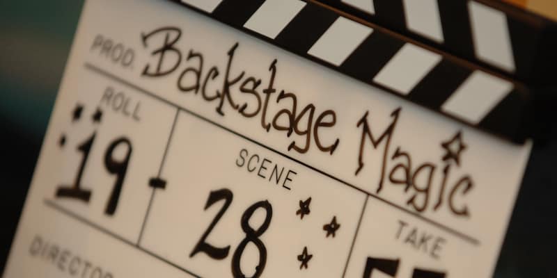 A film slate reading 'Backstage Magic' and giving numbers for 'Roll,' 'Scene,' and 'Take' A film slate reading 'Backstage Magic' and giving numbers for 'Roll,' 'Scene,' and 'Take'