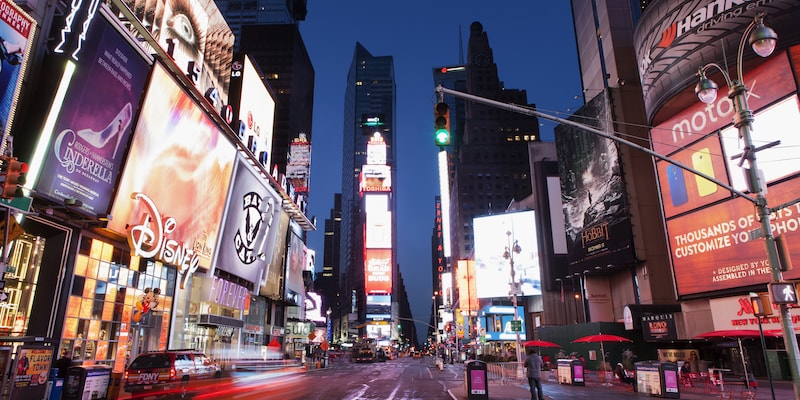 The brightly lit buildings of Times Square at night