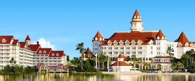 The 3 towers of Disneys Grand Floridian Resort and Spa are right next to a tranquil lake